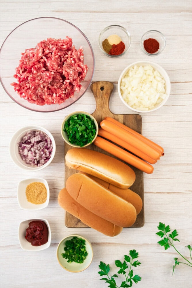 Ground beef mixture for hot dogs with spices and chopped onions.