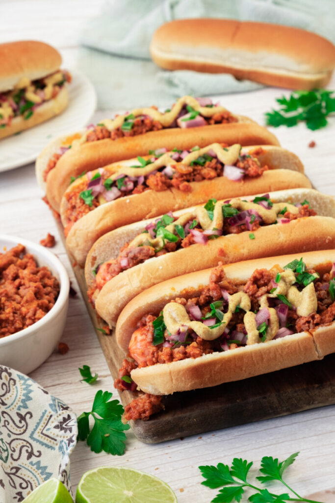 Delicious beef tacos with cheese, lettuce, and herbs on soft taco shells.