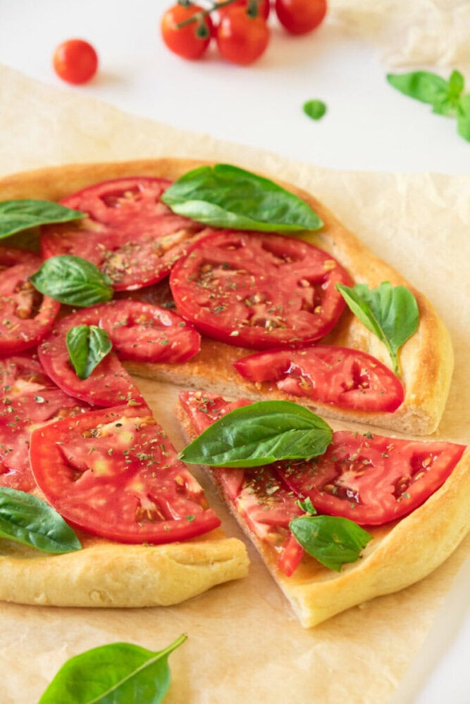 Delicious homemade tomato basil pizza with fresh ingredients and crispy crust.