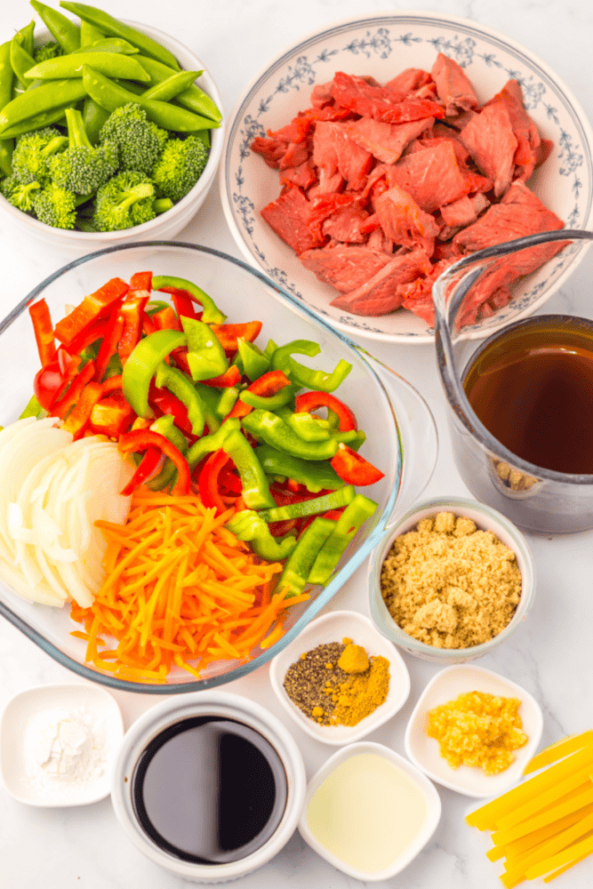 Fresh beef and vegetable ingredients for stir-fry cooking.