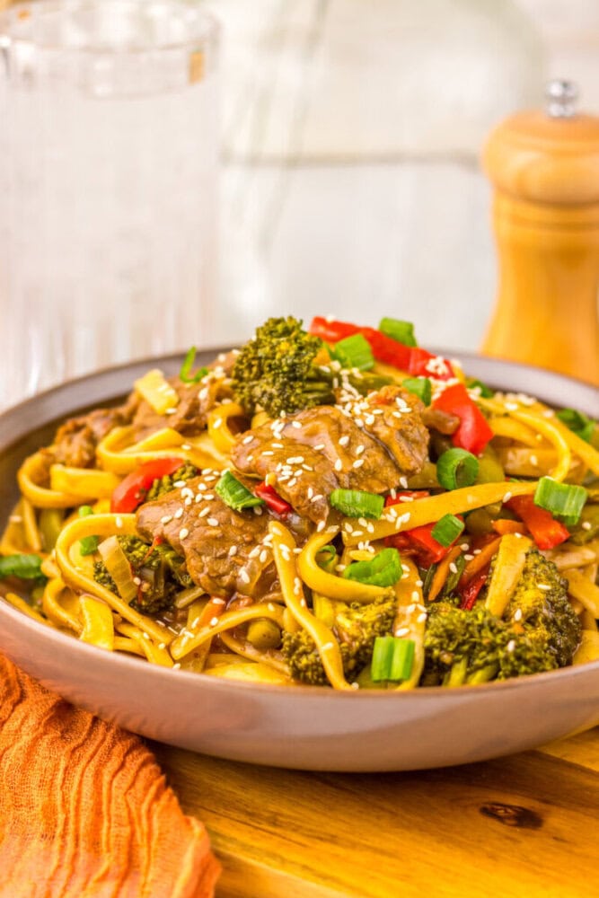 Delicious beef and broccoli stir-fry with colorful vegetables and sesame seeds.