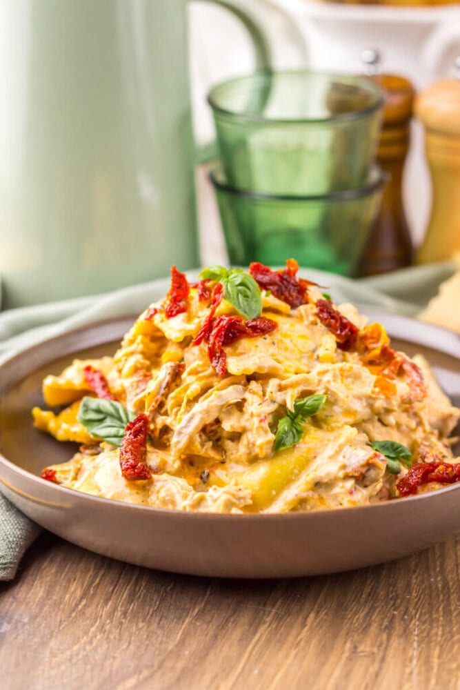 Delicious creamy chicken pasta with bacon and sun-dried tomatoes in a bowl.