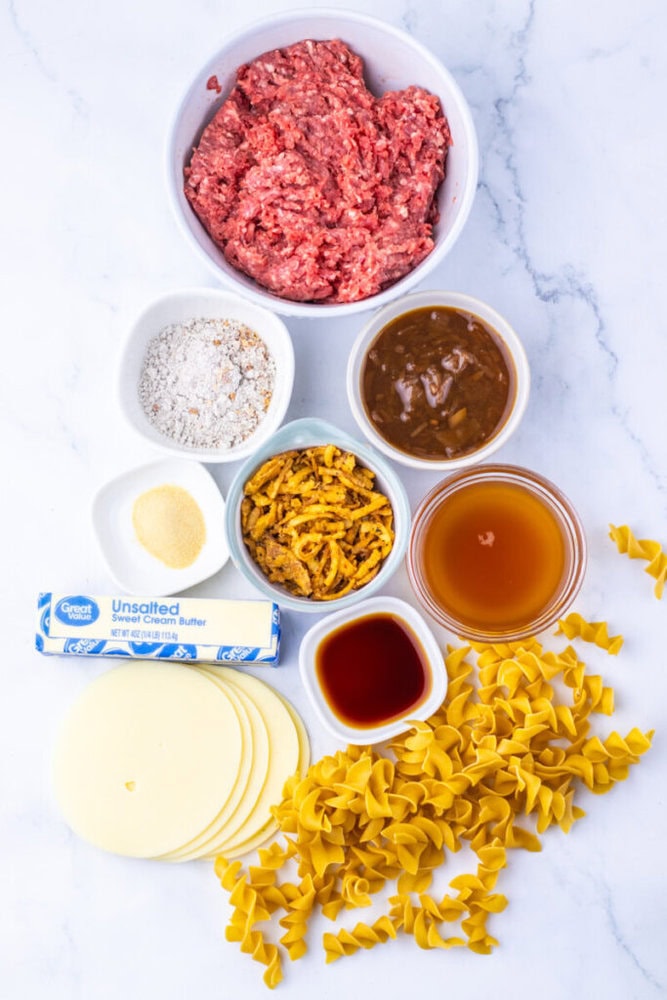 Ground beef and pasta ingredients for lasagna preparation.