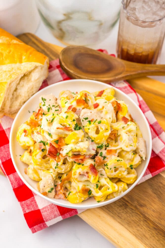 Delicious creamy chicken pasta salad with vegetables and herbs.