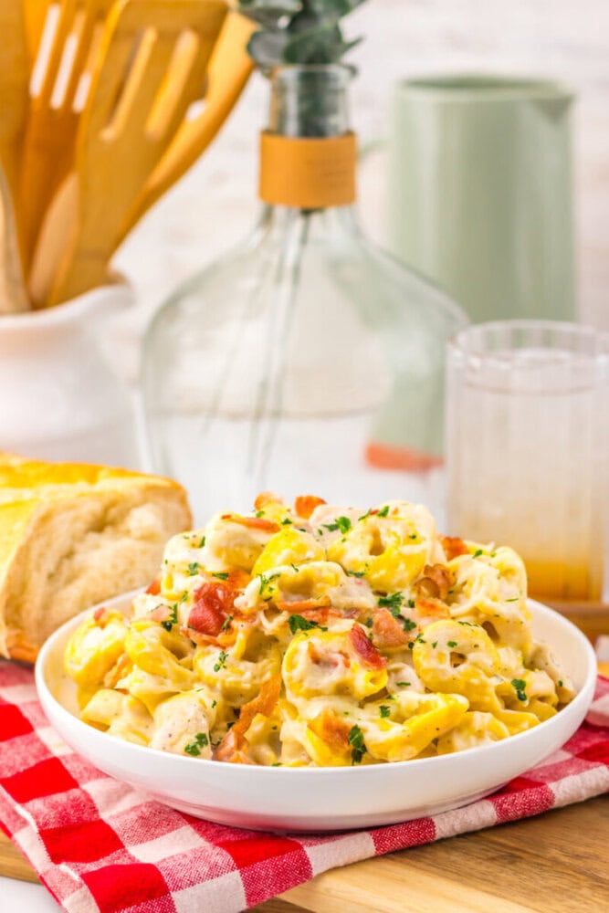 Delicious creamy pasta salad with fresh vegetables and herbs, perfect for summer meals.