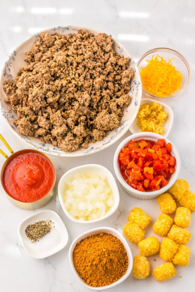 Ground beef tacos with fresh toppings and sauces.