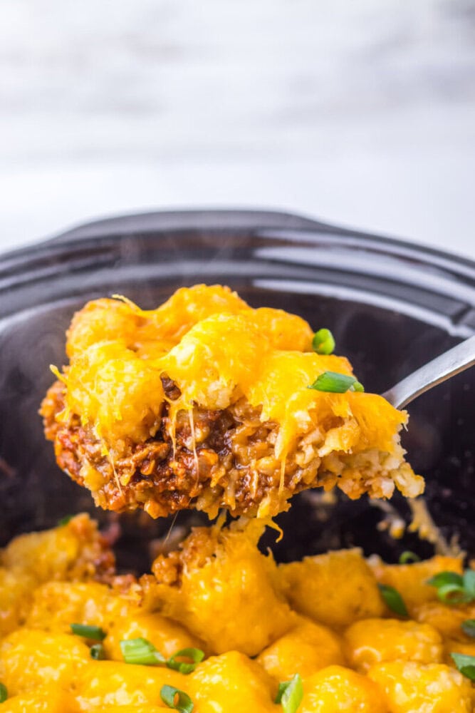 Delicious cheesy beef and potato casserole with melted cheddar cheese and fresh green onions. Perfec.