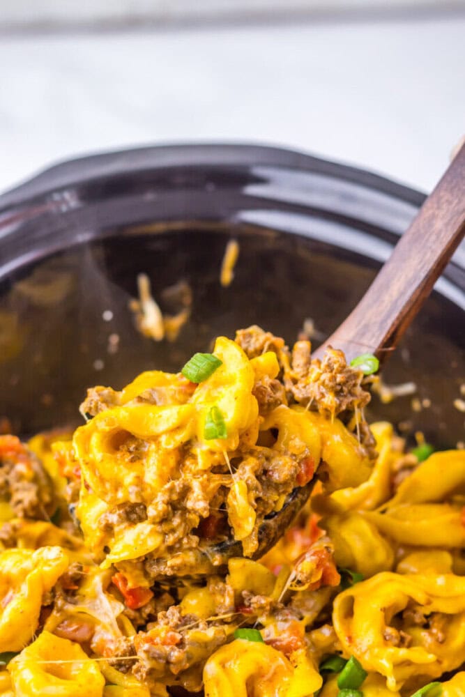 Delicious cheesy beef and pasta casserole with ground meat and vegetables.