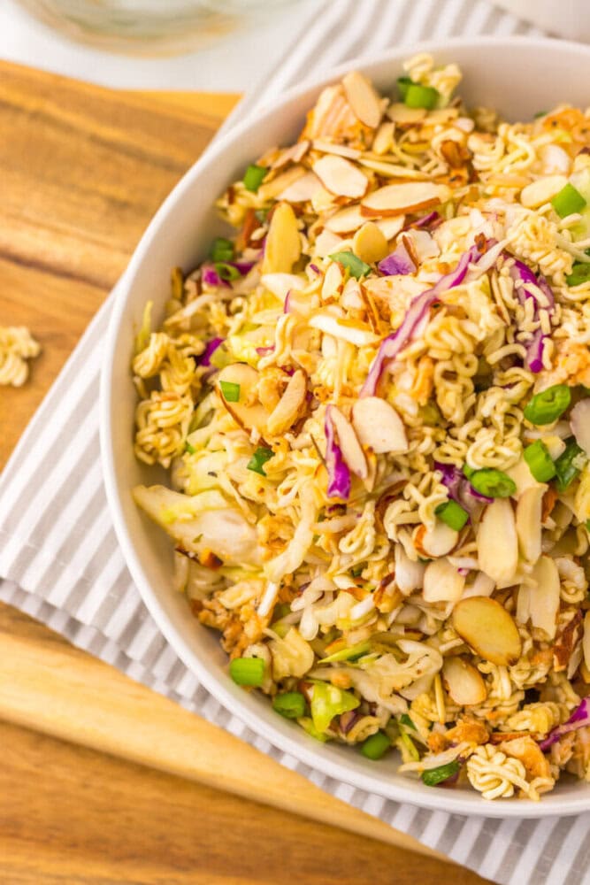 Delicious creamy chicken ramen salad with vegetables and nuts.