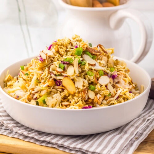 Delicious spicy chicken ramen noodle salad with vegetables and herbs.