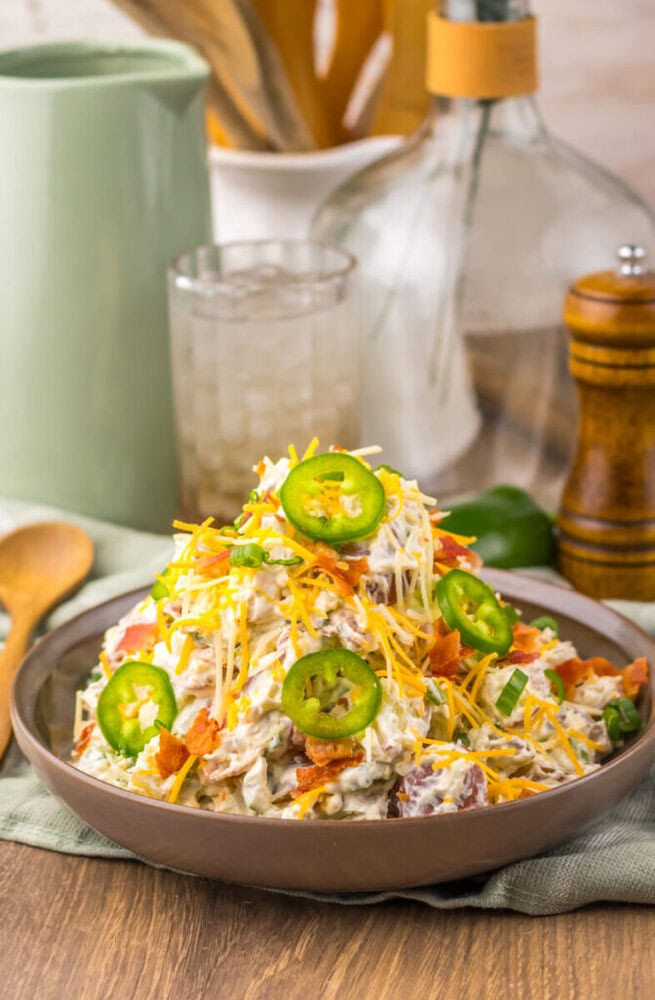 Delicious chicken taco salad topped with jalapeños, cheese, and fresh vegetables.