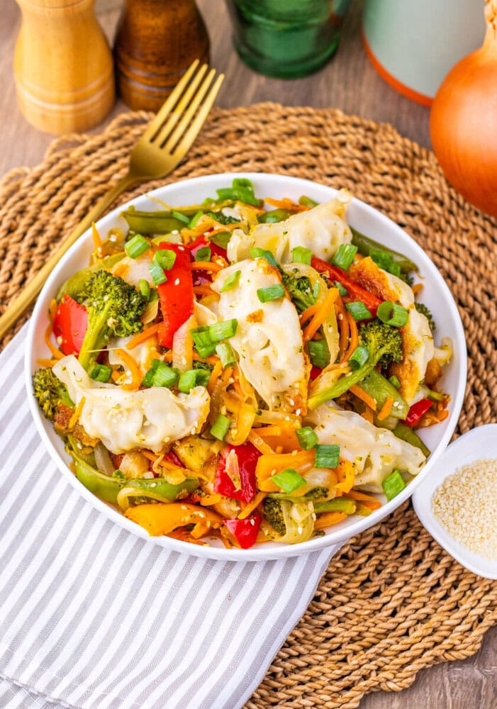 Delicious vegetable stir-fry featuring broccoli, bell peppers, carrots, and onions, perfect for a he.