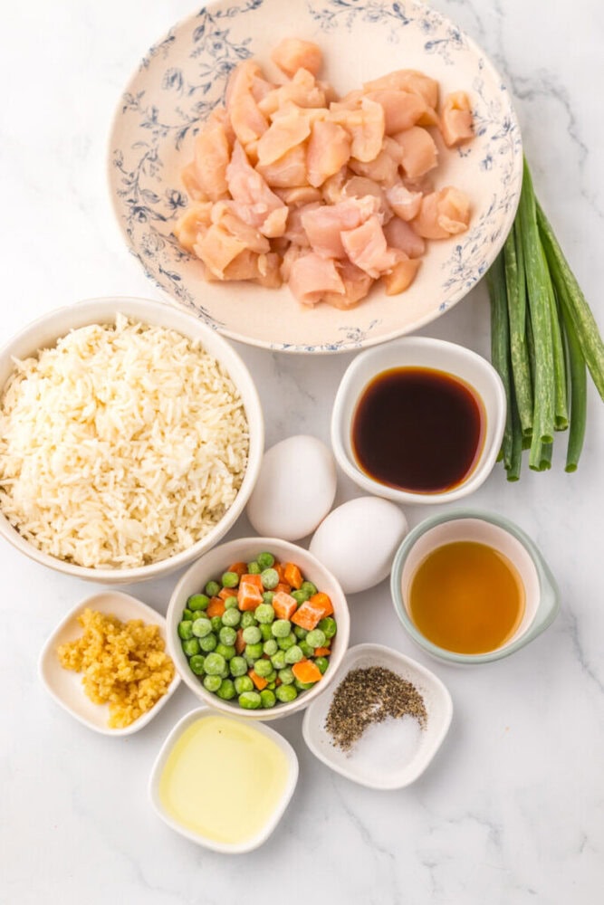 Fresh chicken breast cut into small pieces for cooking.