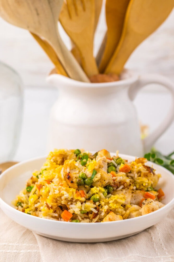 Delicious homemade chicken fried rice with vegetables and herbs.