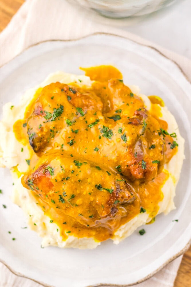 Juicy chicken thighs in rich gravy served over creamy mashed potatoes.
