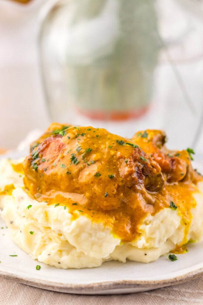 Juicy chicken thigh topped with rich gravy served over creamy mashed potatoes.