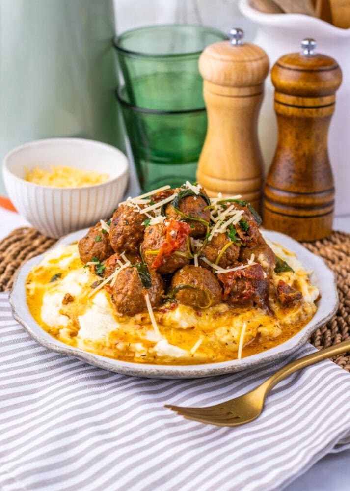 Delicious cheesy beef and vegetable casserole served on a white plate.