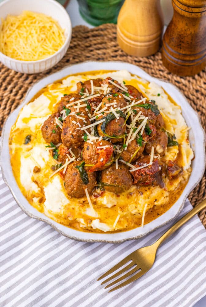 Delicious beef stew with vegetables served over creamy mashed potatoes. Perfect comfort food for col.