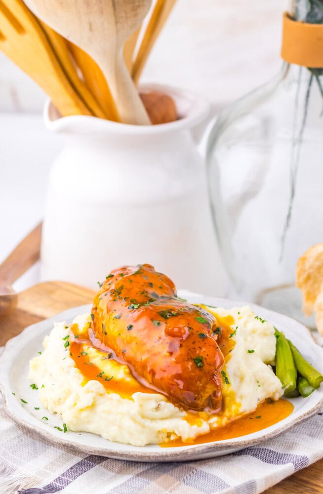 Delicious chicken with gravy served over creamy mashed potatoes and green beans.