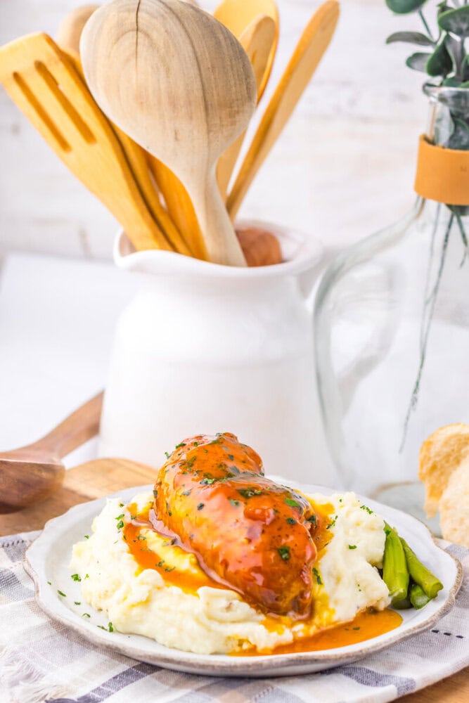 Delicious chicken with gravy served over creamy mashed potatoes and green beans.