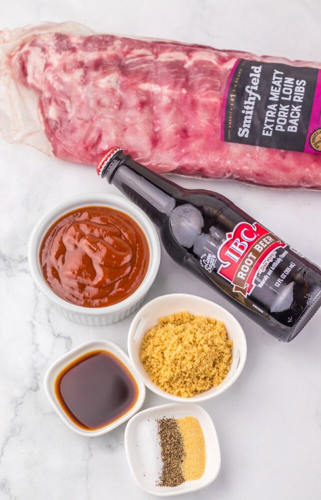Smoked beef ribs with BBQ sauce, mustard, and seasoning on a white surface. Perfect for grilling and.