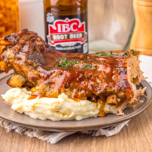 Delicious BBQ ribs served with creamy mashed potatoes and rich barbecue sauce, perfect for a comfort.