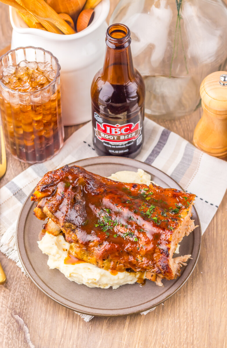 Delicious BBQ ribs served with mashed potatoes and a cold root beer.